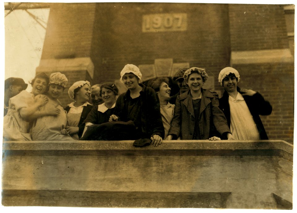 Kerr Thread Mill. All over 16. Having fun with camera man. Good conditions in this mill. Caps to protect hair from dust and to keep hair from getting tangled in machinery. These girls worked LOC nclc.03019