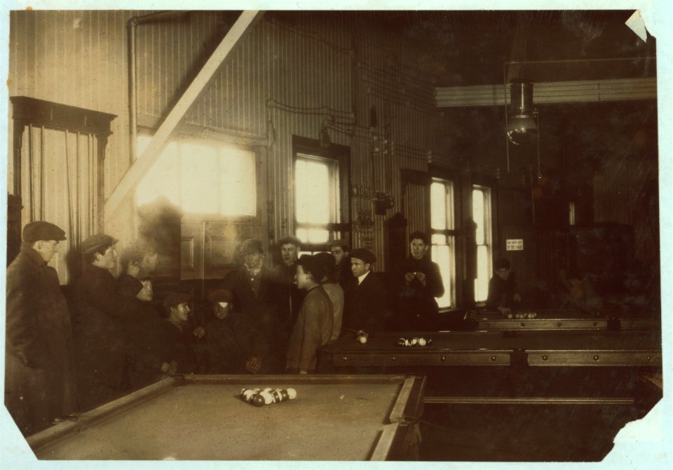 Killing time. Boys and men (many of them workers) hanging around Swifts' Pool Room. Saturday P.M. A common sight any day. Educational influences bad- stories and remarks will not bear LOC nclc.04780