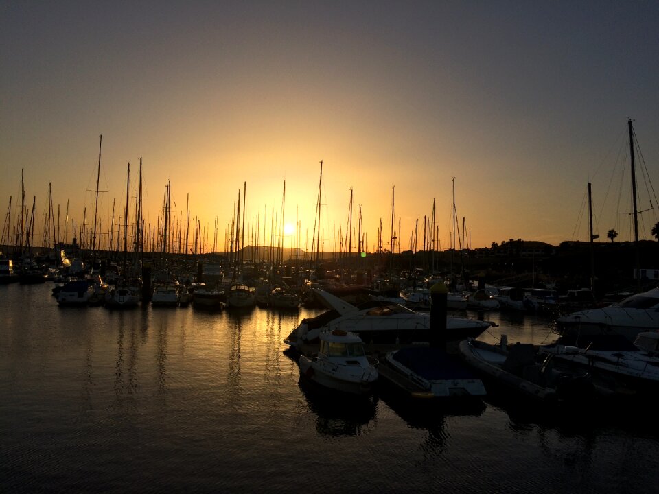 Boats sunset reflections