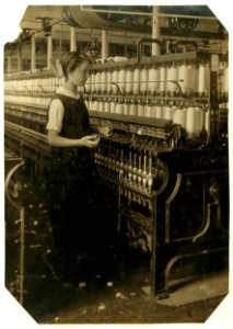 King Philip Spinning Room. Spare hand on spinning frames. Alphonsine Berube, 831 Globe St. Age - 15 years. LOC nclc.03053