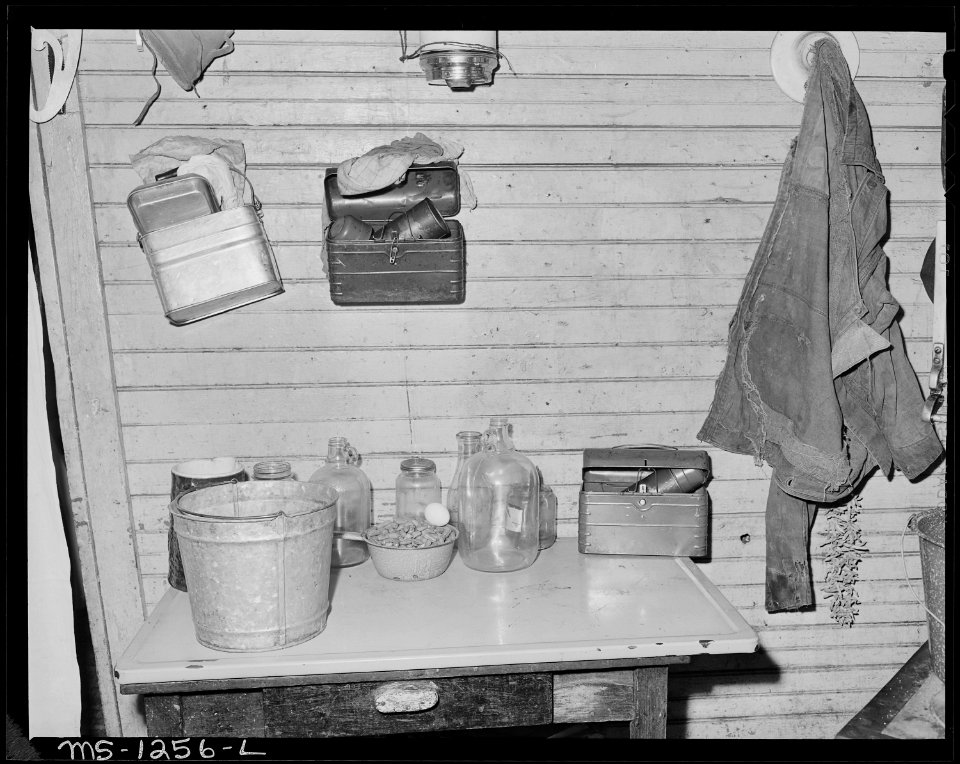 Kitchen table, lunch boxes and mine coat of Mrs. Judy Lester's sons. There is no running water inside house. Kingston... - NARA - 540756