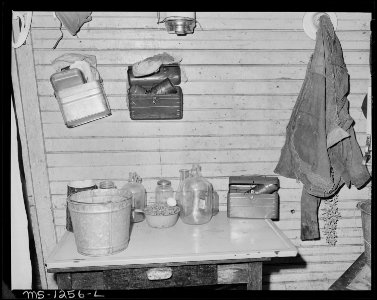 Kitchen table, lunch boxes and mine coat of Mrs. Judy Lester's sons. There is no running water inside house. Kingston... - NARA - 540756