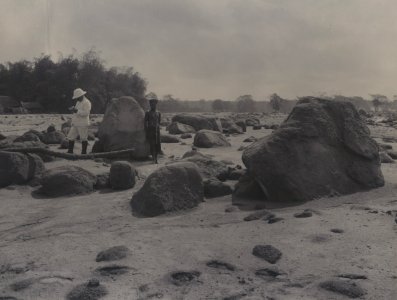 KITLV - 113970 - Kurkdjian, Ohannes - Esquire Teding van Berkhout examines the lava flow in his yard during observations after the eruption of the Mountain Kelud volcano, presumably he stands in river Semred - 1901-05