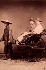 KITLV - 155821 - Two Europeans in a rickshaw pulled by a Chinese man, probably in Singapore - circa 1870