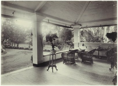 KITLV - 2953 - Kurkdjian - Soerabaja - Mr. A. Paets tot Gansoyen sitting on the porch of his house in Sawahan, Surabaya - 1909