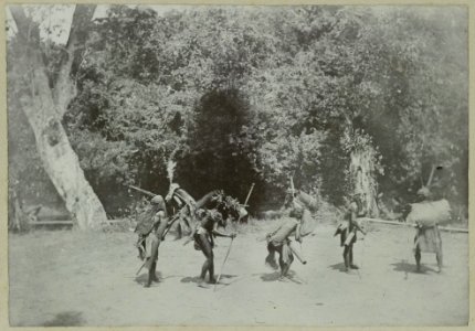 KITLV - 25663 - Demmeni, J. - Masquerade of Kayan Dayaks on the Bloeoe River, Upper Mahakam, Central Borneo at the seed sowing festival. They poke fun at the Poenans, small tribes living in the woods hunting - 1896-09-01