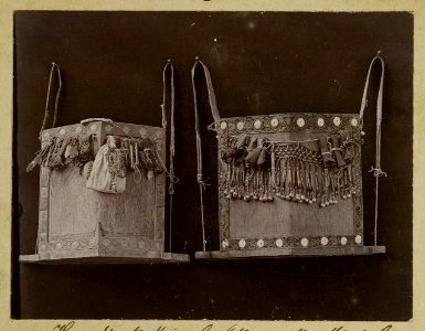 KITLV - 25793 - Demmeni, J. - Hawats (= wooden board to support children) of Kayan headmen on the Mendalam, Upper Kapuas River (Sungai Kapuas) - 1896-1897