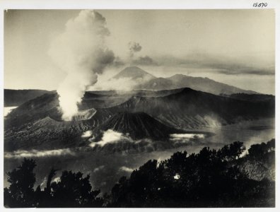 KITLV - 15670 - Kurkdjian - Mount Bromo (Gunung Bromo) with the Sand Sea (Lautan pasir) in the Tengger Mountains. In the background Gunung Gunung Semeru, East Java - circa 1920 photo