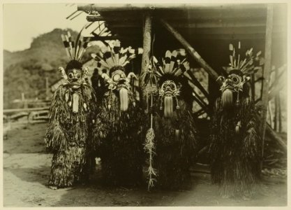 KITLV - 25677 - Demmeni, J. - Four hoedo kajoh; Kayans dressed as ghosts, Upper Mahakam, Central Borneo - 1898-1900