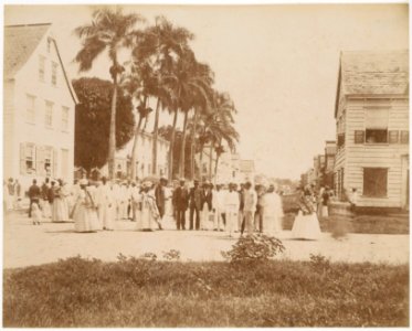 KITLV - 39039 - Muller, Julius Eduard - Paramaribo - Members of the Evangelical Confraternity (Moravian Church) in front of the Gote Stadskerk (at left behind the trees) in Paramaribo - circa 1885