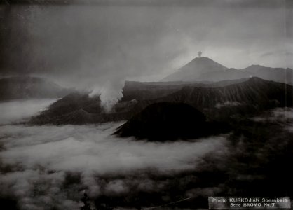 KITLV - 86727 - Kurkdjian - Soerabaia - Bromo and Batok in the Sand Sea (Lautan Pasir) in the Tengger Mountains. In the background the Gunung Semeru East Java - circa 1910