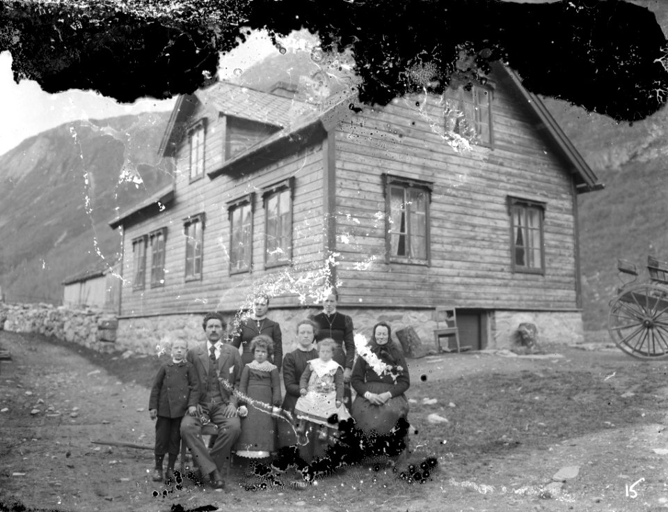Knut A. Aaning A family outside their home.