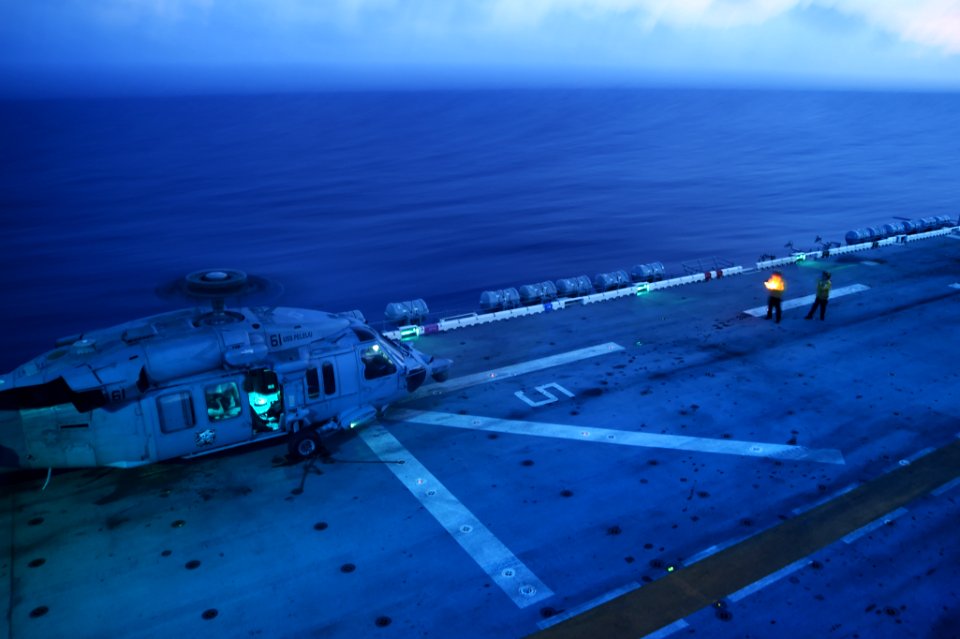Knighthawk prepares for evening flight operations aboard USS Peleliu 140925-N-NZ935-004