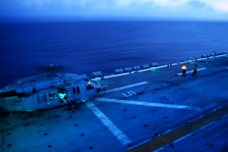Knighthawk prepares for evening flight operations aboard USS Peleliu 140925-N-NZ935-004