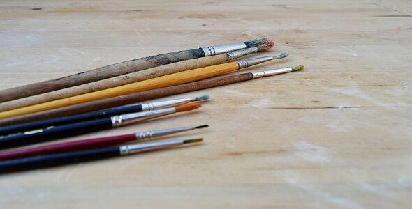 Brushes for oil painting wood background photo