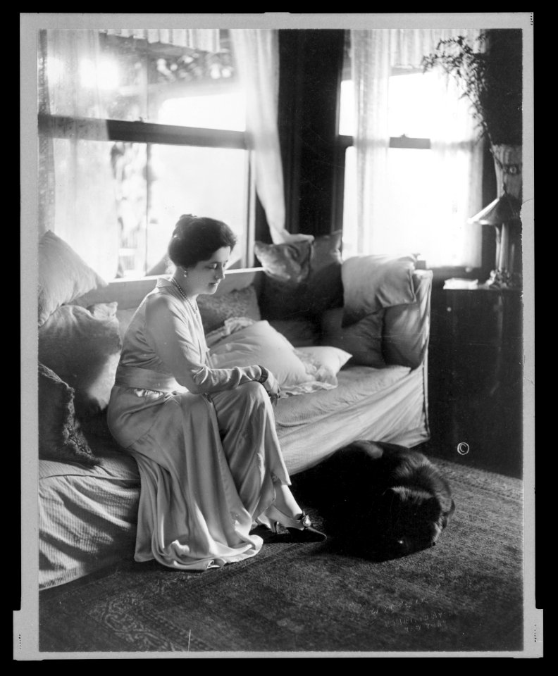 Lady Lucy Duff-Gordon, full-length portrait, seated, facing right, with a dog at her feet) - Marceau LCCN2005691116