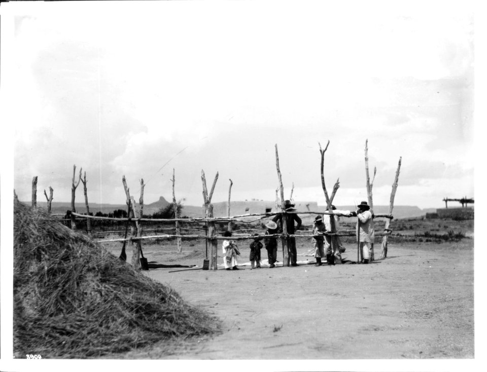 Laguna Indians threshing and winnowing wheat at the pueblo town of Paquate, New Mexico, ca.1900 (CHS-3909)
