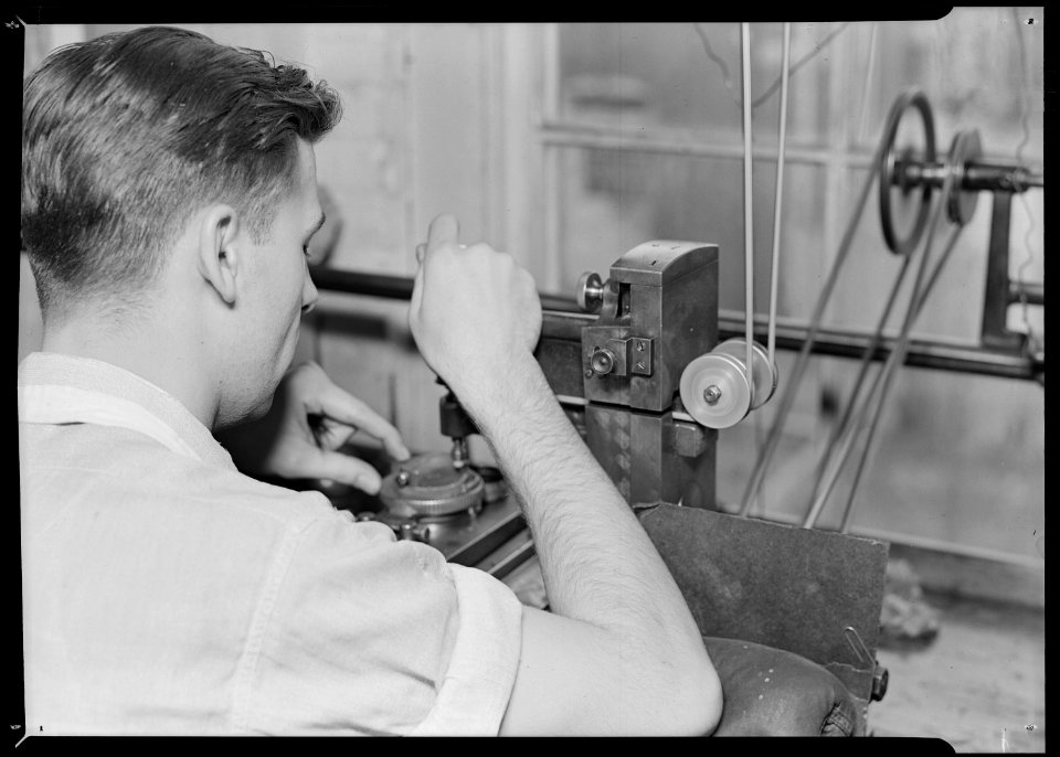 Lancaster, Pennsylvania - Hamilton Watch. Damaskeening - skilled machine operation for putting finishing lines on... - NARA - 518425