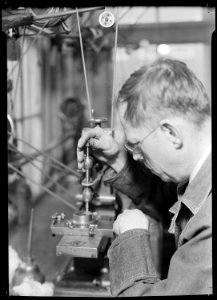 Lancaster, Pennsylvania - Hamilton Watch. Damaskeening - skilled machine operation for putting finishing lines on... - NARA - 518427