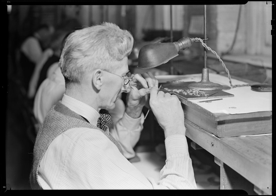 Lancaster, Pennsylvania - Hamilton Watch. Operation - inspecting plate - skilled inspecting job (all plates must... - NARA - 518429