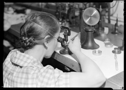 Lancaster, Pennsylvania - Hamilton Watch. Operation - rectifying wheels - semi-skilled machine operation by which any... - NARA - 518435