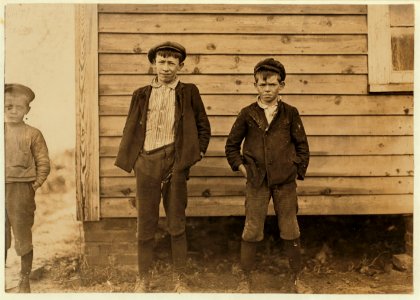 Maple Mills, Dillon, S.C. Lonnie Baker (tallest). Has doffed 4 years. Gets 40 cents a day. Bertie Baser-10 years old. 3 years in mill. Runs 3 sides = 30 cents a day. LOC nclc.01485