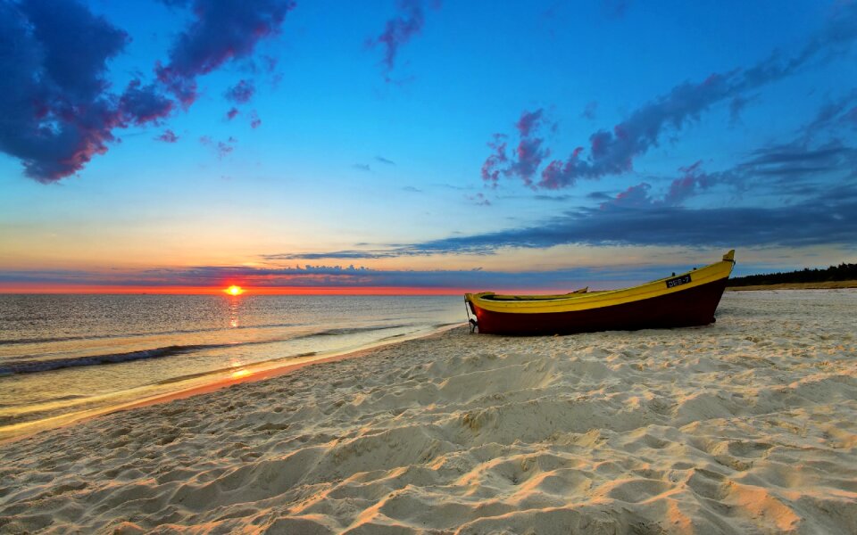 Beach sunset boat