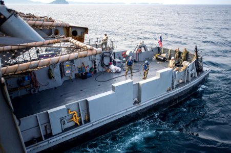 Landing Craft Utility 1666 exits well deck of USS Denver 140427-N-IC565-036