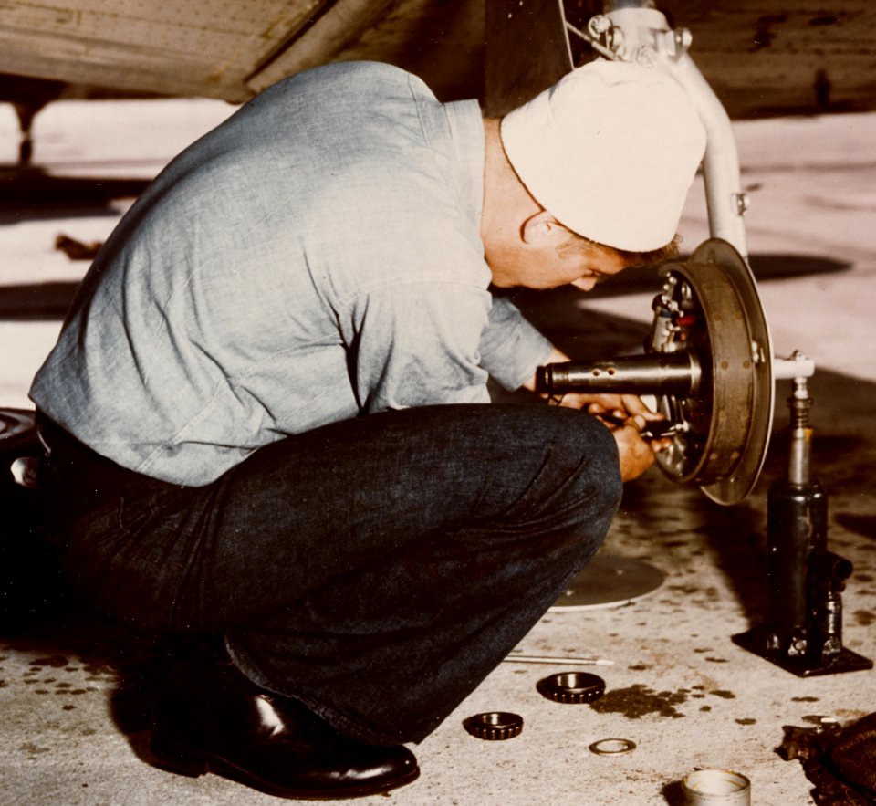 Landing gear repair on a North American SNJ at Naval Air Station Norfolk on 20 April 1945 (80-G-K-4632) (cropped)