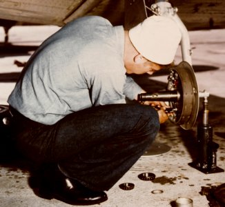 Landing gear repair on a North American SNJ at Naval Air Station Norfolk on 20 April 1945 (80-G-K-4632) (cropped) photo