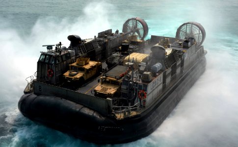 Landing Craft Air Cushion 8 assigned to Naval Beach Unit 7, departs the well deck of the forward-deployed amphibious assault ship USS Bonhomme Richard (8464497271)