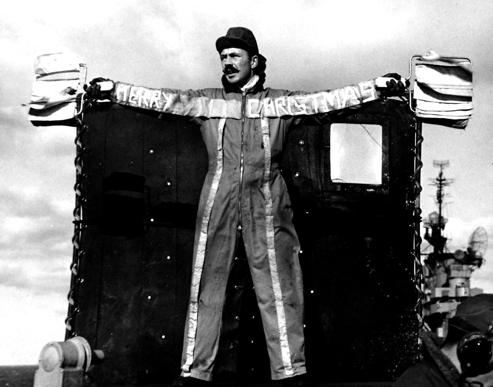 Landing Signal Officer aboard USS Leyte (CV-32) with Christmas greetings, 24 December 1950 (80-G-426182)
