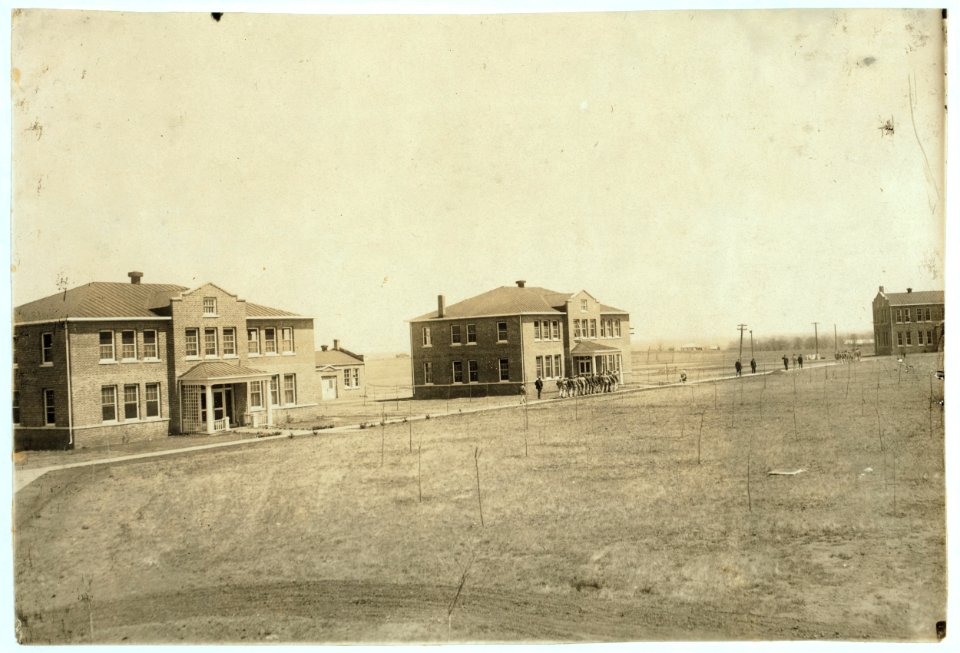 Marching to dinner from 'Honor Cottage' and another dormitory at Pauls Valley Training School. See Gibbons report. LOC nclc.05242