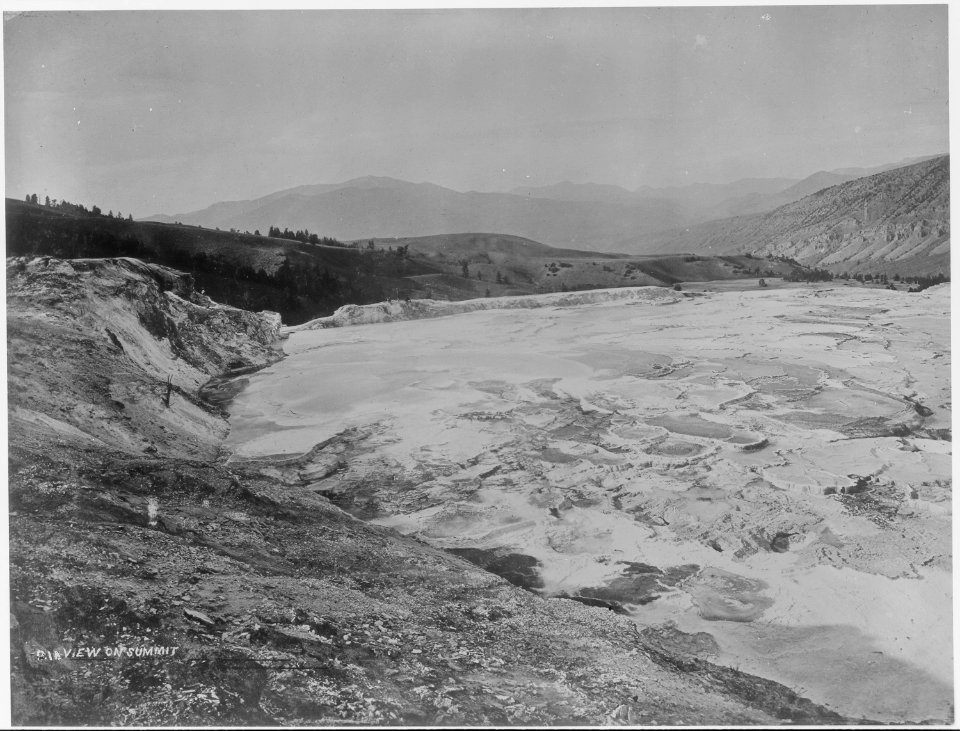 Large spring on summit which supplies the bathing pools with their water, Yellowstone. - NARA - 516682