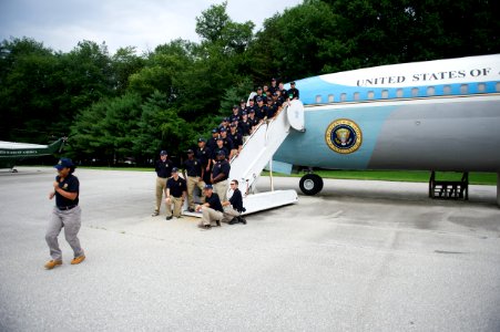 Law enforcement explorers aboard stairs to plane 3
