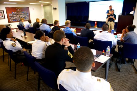 Law enforcement explorers from various agencies listen to speaker photo