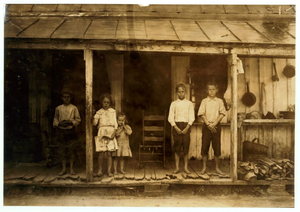 Lawrence Purdie (right end) has been spinning in the mule room of the cotton mill at Matoaca, Va., for two years. His brother, next to him, helps in the mill. The others in the photo are not LOC cph.3b36984