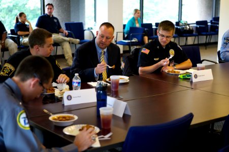 Law enforcement explorers seated around a table photo