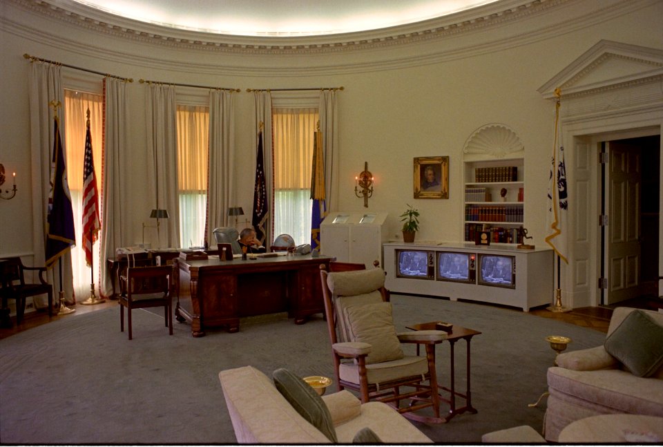 LBJ watching TV in the Oval Office