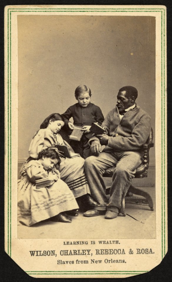Learning is wealth. Wilson, Charley, Rebecca, and Rosa. Slaves from New Orleans - Chas. Paxson, photographer, New York. LCCN2010647859