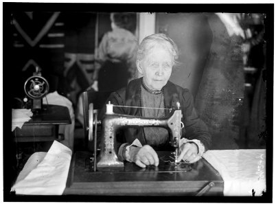 LEGION OF LOYAL WOMEN. MRS. A.J. HUGHES, SEWING ON BEDDING FOR HOSPITALS LCCN2016869083