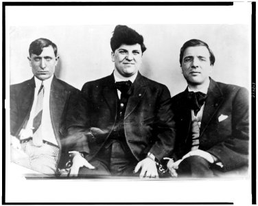 Left to right- Joseph Caruso, Joseph J. Ettor, and Arturo Giovannitti, half-length portraits, seated, in handcuffs LCCN93511627
