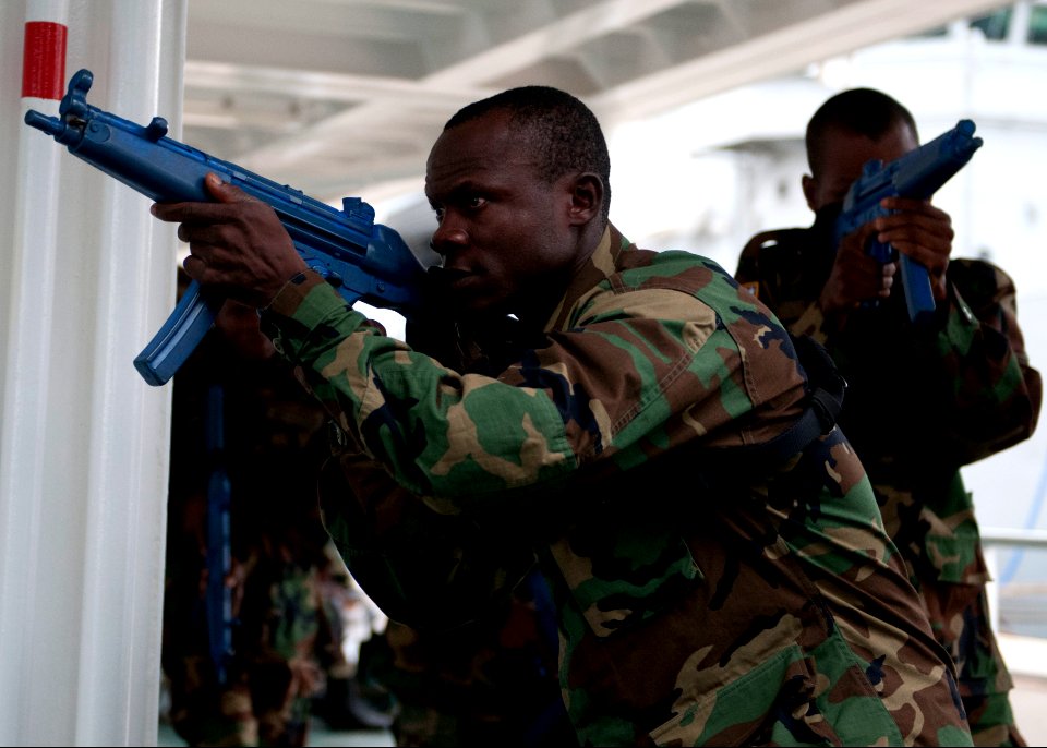 Liberian service members practice room clearing and tactical movement techniques aboard the Spanish Civil Guard patrol ship Rio Segura March 8, 2014, in Dakar, Senegal, during exercise Saharan Express 2014 140308-N-QY759-074