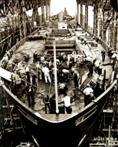 Liberty Ship hull being cleaned up for launching ceremony, WWII (26248526764)