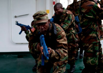 Liberian service members practice room clearing and tactical movement techniques aboard the Spanish Civil Guard patrol ship Rio Segura March 8, 2014, in Dakar, Senegal, during exercise Saharan Express 2014 140308-N-QY759-075