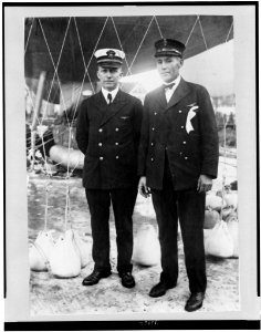 Lieut. W. Reed, Pensacola, Florida, and Chief Rigger Kit Mallenax of Pensacola, flyers of one of the Navy balloons in the Milwaukee race, standing under balloon LCCN95506356