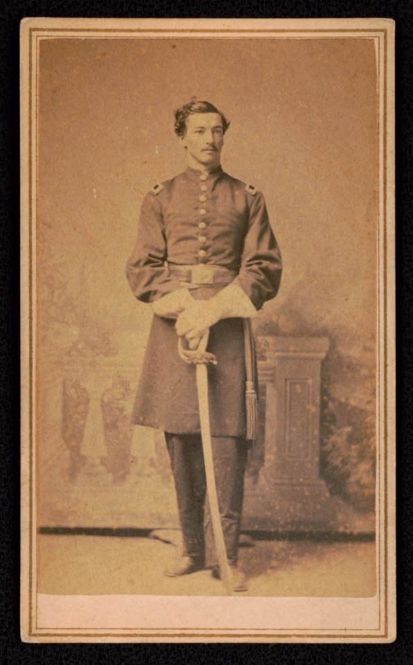 Lieutenant Leroy D. Ball of Co. G, 15th Massachusetts Infantry Regiment and Co. D, 82nd U.S. Colored Troops Infantry Regiment in uniform with sword in front of painted backdrop) - S. Moses & LCCN2017648751