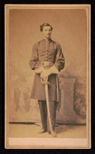 Lieutenant Leroy D. Ball of Co. G, 15th Massachusetts Infantry Regiment and Co. D, 82nd U.S. Colored Troops Infantry Regiment in uniform with sword in front of painted backdrop) - S. Moses & LCCN2017648751