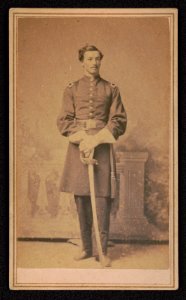 Lieutenant Leroy D. Ball of Co. G, 15th Massachusetts Infantry Regiment and Co. D, 82nd U.S. Colored Troops Infantry Regiment in uniform with sword in front of painted backdrop) - S. Moses & LCCN2017648751 photo