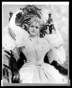 Lillian Russell, three-quarter length portrait, seated, with arms above head LCCN2005691136